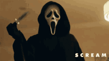 a person in a scream mask is holding a knife in their hand