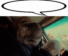 a man in a car with a speech bubble behind him