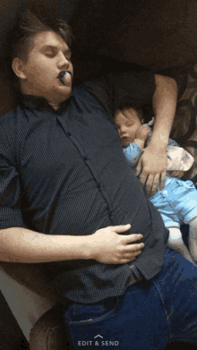 a man with a pacifier in his mouth is sleeping with a baby on his lap