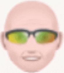 a bald man wearing sunglasses with green lenses is smiling .