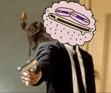 a man in a suit and tie is pointing a gun at a cartoon character with a hot dog on his head