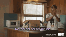 a man in a white shirt is clapping in a kitchen with the words na na na na na na na on the bottom