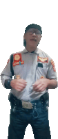 a man in a police uniform has a patch on his chest that says ' bnkc ' on it