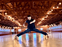 a man is rollerblading in a large room