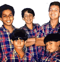 a group of young boys wearing plaid shirts smile for the camera