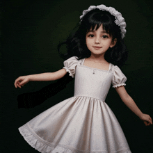 a little girl in a white dress and headband