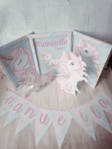 a banner that says " manuela 1 ano " is hanging on a wooden floor