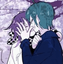 a couple of anime characters are hugging each other and kissing each other .