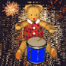 a teddy bear is playing a blue drum