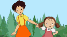 a girl in a pink dress is holding the hand of a girl in a yellow shirt