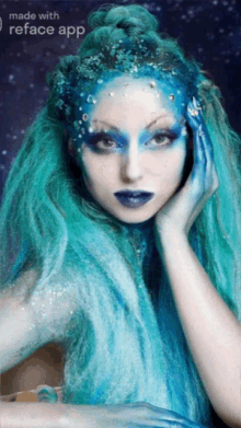 a picture of a woman with blue hair and makeup made with reface app