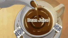 a cup of coffee with bean juice written on the bottom