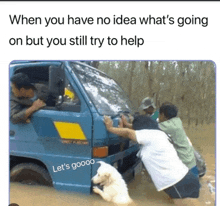 a group of people pushing a truck through a flood