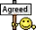 a smiley face is holding a sign that says agreed .