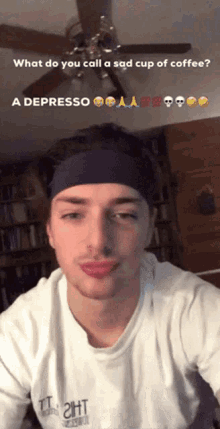 a man wearing a headband and a white shirt that says " tight "