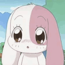 a close up of a cartoon rabbit with pink ears and a surprised look on its face .