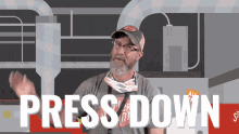 a man with a beard wearing a hat and glasses says press down