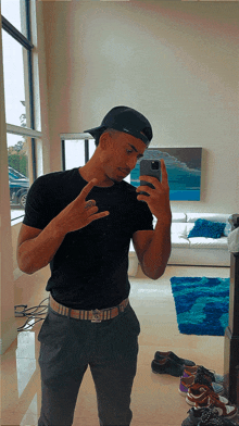 a man taking a selfie in front of a mirror