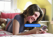 a girl laying on a bed with a text message that says xxx