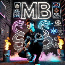 a man is kneeling in front of a wall that says mb on it