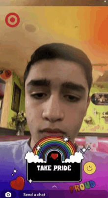 a young man with a rainbow on his face and the words take pride on the bottom