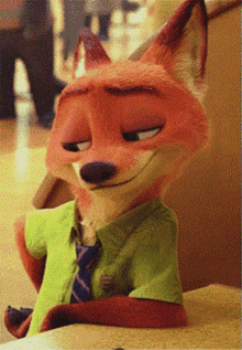 a fox wearing a green shirt and tie is sitting on a couch