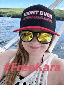 a woman wearing sunglasses and a hat that says i don t even karraaana