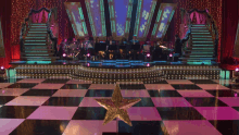 a checkered dance floor with a star on it