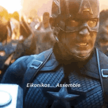 a close up of captain america 's face with the words eikonikos assemble below him