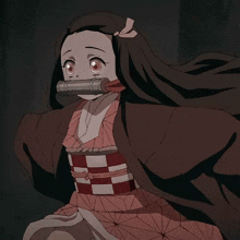 a close up of a girl with long hair and a sword in her mouth from demon slayer .