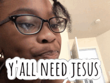 a woman wearing glasses has a sticker on her face that says " y'all need jesus "