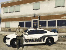 a man stands next to a pima county sheriff car