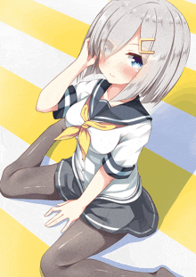 a girl with gray hair is sitting on a yellow and blue checkered floor