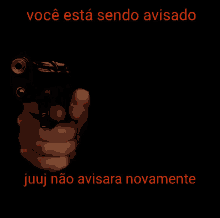 a hand pointing a gun with the words você esta sendo avisado juuj não avisara novamente below it