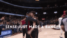 a basketball player is hugging another player with the words sense just made a banger above them