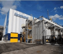 a large white and blue building with the word akzonobel on it