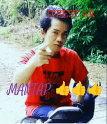 a man in a red shirt is sitting on a motorcycle and giving a thumbs up with the words mantap on the bottom