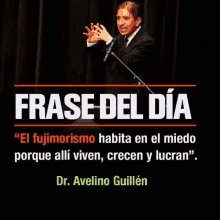 a man stands in front of a microphone with a quote from dr. avelino guillen