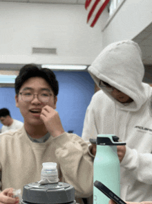 a man wearing a white sweatshirt with the word polaris on it