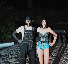 a man in overalls and a woman in a corset stand next to each other