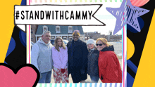 a group of people standing in front of a sign that says " standwithcammy "