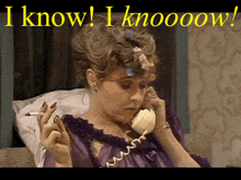 a woman with curlers in her hair is talking on a telephone while holding a cigarette ..