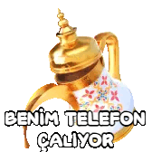 a gold and white teapot with the words benim telefon caliyor on it