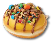 a donut with nuts and m & ms on top