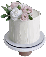 a white cake with pink flowers on top of it