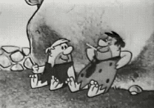 a black and white cartoon of the flintstones sitting next to each other .