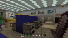 a screenshot of a minecraft game shows a room with a blue wall