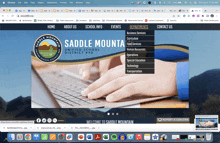 a saddle mountain website shows a person using a laptop