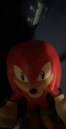 a close up of a sonic the hedgehog knuckles figurine