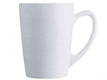 a white coffee mug with a handle is sitting on a white surface .